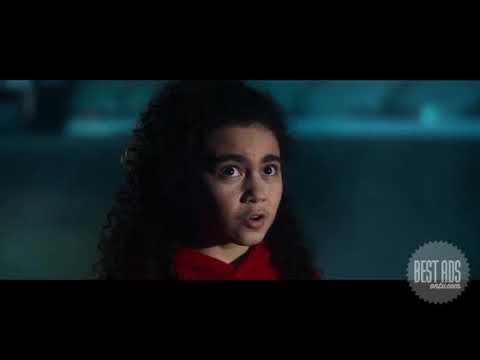 New Zealand Maori girl looking up in stadium at night with lights